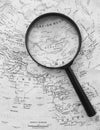 World map with a magnifying glass