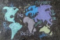 World map painted on the floor in the street with colored chalks with words \