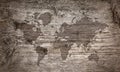 World map silhouete on old wooden surface