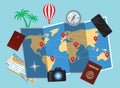 World map and traveller personal belongings over blue background