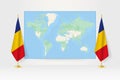 World Map between two hanging flags of Romania flag stand Royalty Free Stock Photo