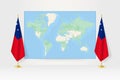 World Map between two hanging flags of Samoa flag stand Royalty Free Stock Photo