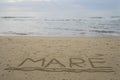 World `mare` sea in italian hand written underlined on sand Royalty Free Stock Photo