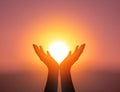 World Mental Health Day concept: Silhouette prayer hands in the sunset sky background Royalty Free Stock Photo