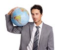 The world is mine to conquer. A handsome young executive holding a globe while isolated on a white background. Royalty Free Stock Photo