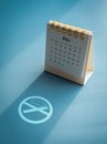 World No Tobacco Day concept. Shape of No smoking flat icon shining on the blue background in the shadow of May, 2023 page. Royalty Free Stock Photo