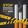 World no tobacco day, stop smoking before smoke stop you - Three cigarette with smoke and yellow danger caution tape cross on Royalty Free Stock Photo