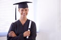 The world is now her oyster. Portrait of a young woman in a graduation gown holding a diploma. Royalty Free Stock Photo