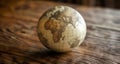 World in a nutshell - A vintage globe on a wooden table Royalty Free Stock Photo