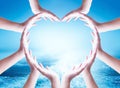 World ocean day concept: Collaborative human hands grouped in heart shape Royalty Free Stock Photo