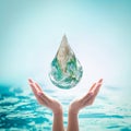 World ocean day, saving water, environmental protection, sustainable ecological ecosystems concept with green earth drop on hands