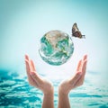 World ocean day, saving water, environmental protection, sustainable ecological ecosystems concept with green earth on hand Royalty Free Stock Photo