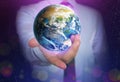 World in our hands. Man holding digital model of Earth, closeup view Royalty Free Stock Photo