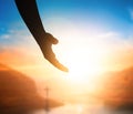 World Peace Day concept:Silhouette of Jesus reaching out hand Royalty Free Stock Photo