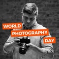 World photography day text on red banners over happy caucasian male photographer looking at camera Royalty Free Stock Photo