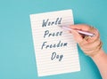 World Press Freedom Day is standing on a paper, hand with pen is chained, free speech, cancel culture, journalist writing Royalty Free Stock Photo