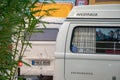 Normal camper in front of the world record full-size VW campervan made out of Lego, at the free fair in munich