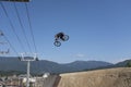 A bike rider at Crankworx Whistler 2022 practices his jumps