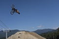 A slopestyle rider practices for the Crankworx Whistler 2022 finals
