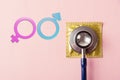 Medical equipment, condom in pack, doctor stethoscope and Male and female gender signs