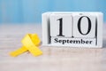 World Suicide prevention day 10 September, Yellow Ribbon for supporting people living and illness. Stop and Save Suicidal