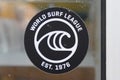 World Surf League WSL logo brand and text sign on windows surfing shop governing body