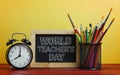 World Teacher`s Day Text. Alarm Clock, Blackboard and School Sta