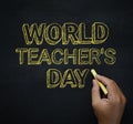 World Teacher`s Day Text. Male Hand Writing on Empty Blackboard