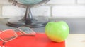 World teachers ` Day in school. Still life with books, globe, Apple, glasses selective focus Royalty Free Stock Photo