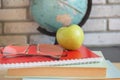 World teachers Day in school. Still life with books, globe, Apple, glasses selective focus Royalty Free Stock Photo