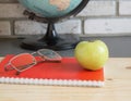 World teachers Day in school. Still life with books, globe, Apple, glasses selective focus Royalty Free Stock Photo