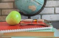 World teachers ' Day in school. Still life with books, globe, Apple, glasses Royalty Free Stock Photo