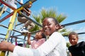 The world is their playground. Portrait of a happy little girl playing on a jungle gym. Royalty Free Stock Photo