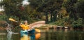 World Tourism Day banner. Happy caucasian woman floating with splashes in kayak at river. Copy space. The concept of Royalty Free Stock Photo