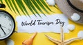 World Tourism Day Typography. Ripped Paper Between Flat Lay Summer Beach Accessories
