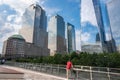 One man looks at World Trade Center glass building and NYC cityscape Royalty Free Stock Photo