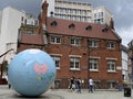 The World Turned Upside Down, is a globe, which stands inverted on the north pole, outside London School of Economics