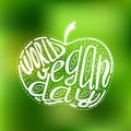 World Vegan Day. Lettering handmade with the name of the event inscribed in the apple