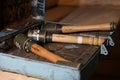 World War II fragmentation grenades stacked in a military box on wooden table in dark interior