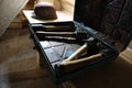 World War II fragmentation grenades stacked in a military box on wooden table in dark interior Royalty Free Stock Photo