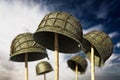 World War II helmets against blue sky. 3D illustration