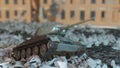 A world war II military tank stands on the ruins of a ruined abandoned city. 3D Rendering Royalty Free Stock Photo