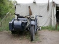 World War II Motorcycle With Sidecar And Mounted Ammunition Boxes And Mg-42 Machine Gun. German Military Motorcycle Painted In Dar