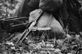 World War II Soviet Red Army Weapon. Submachine Gun PPS-43 On Ground. WWII WW2 Russian Ammunition. Photo In Black And