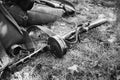 World War II Soviet Red Army Weapon. Submachine Gun PPSh On Ground. WWII WW2 Russian Ammunition. Photo In Black And