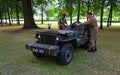 World War 2 Jeep with driver and passenger in uniform.