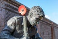 A world war two soldier statue with a red poppy attached to his rifle Royalty Free Stock Photo