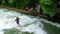 Action Surfer in Downtown Munich Germany near the English Gardens at the Eisbachwelle. Royalty Free Stock Photo