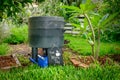 Worm farm compost bin in organic Australian garden with Feed Me worm sign, sustainable living and zero waste lifestyle