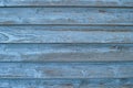 Worn blue board siding